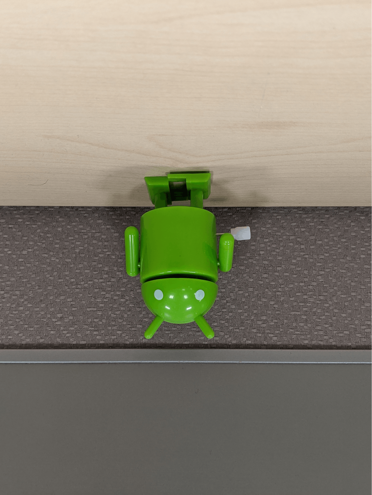 A landscape-shaped image with the bugdroid's head pointed upwards